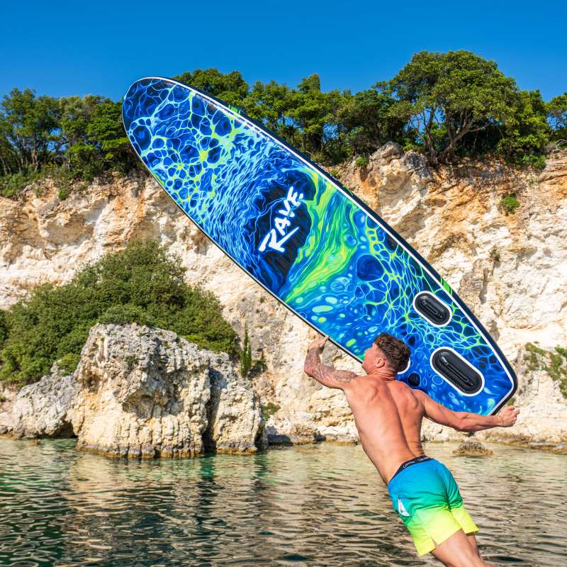 a man about to throw his paddle board on the water