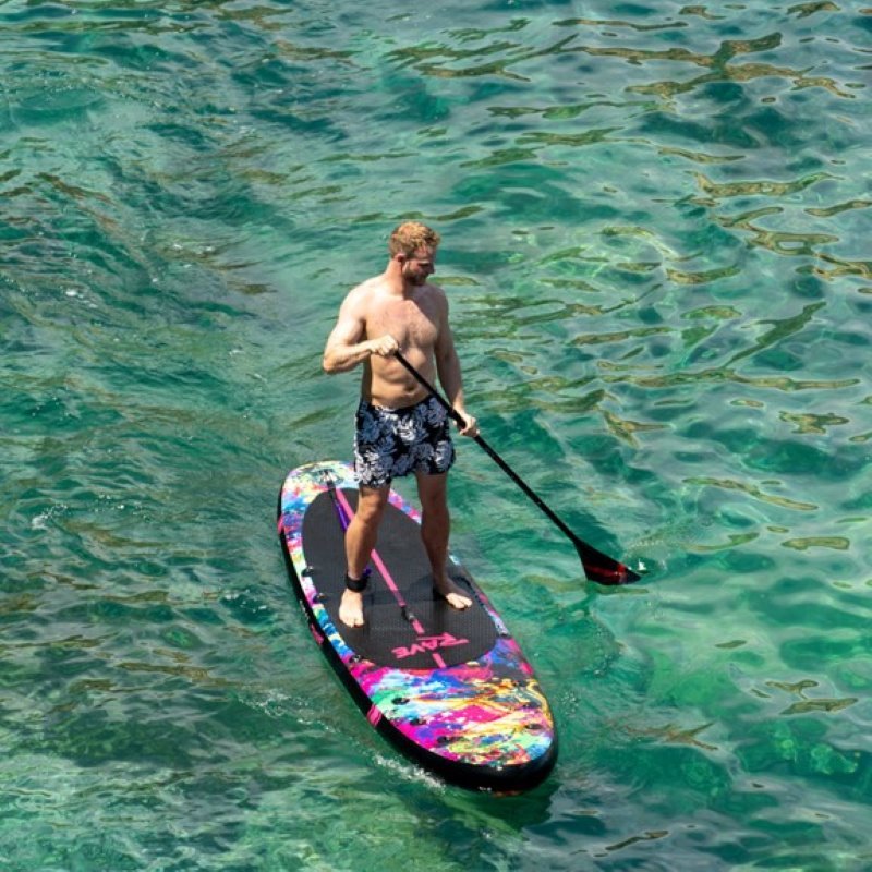 man standing on a paddle board