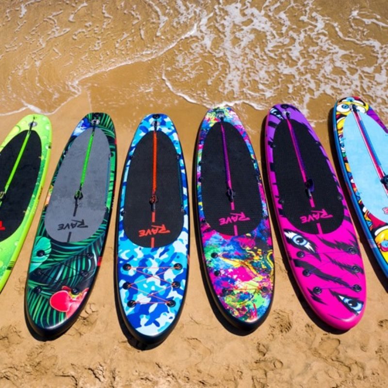 colorful paddle boards on the beach